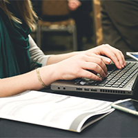 Hands typing on keyboard