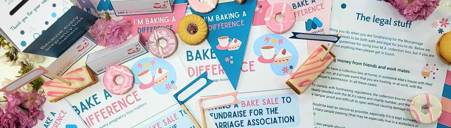Fundraising materials for Miscarriage Association’s Bake a Difference campaign featuring cakes, flyers, and bunting